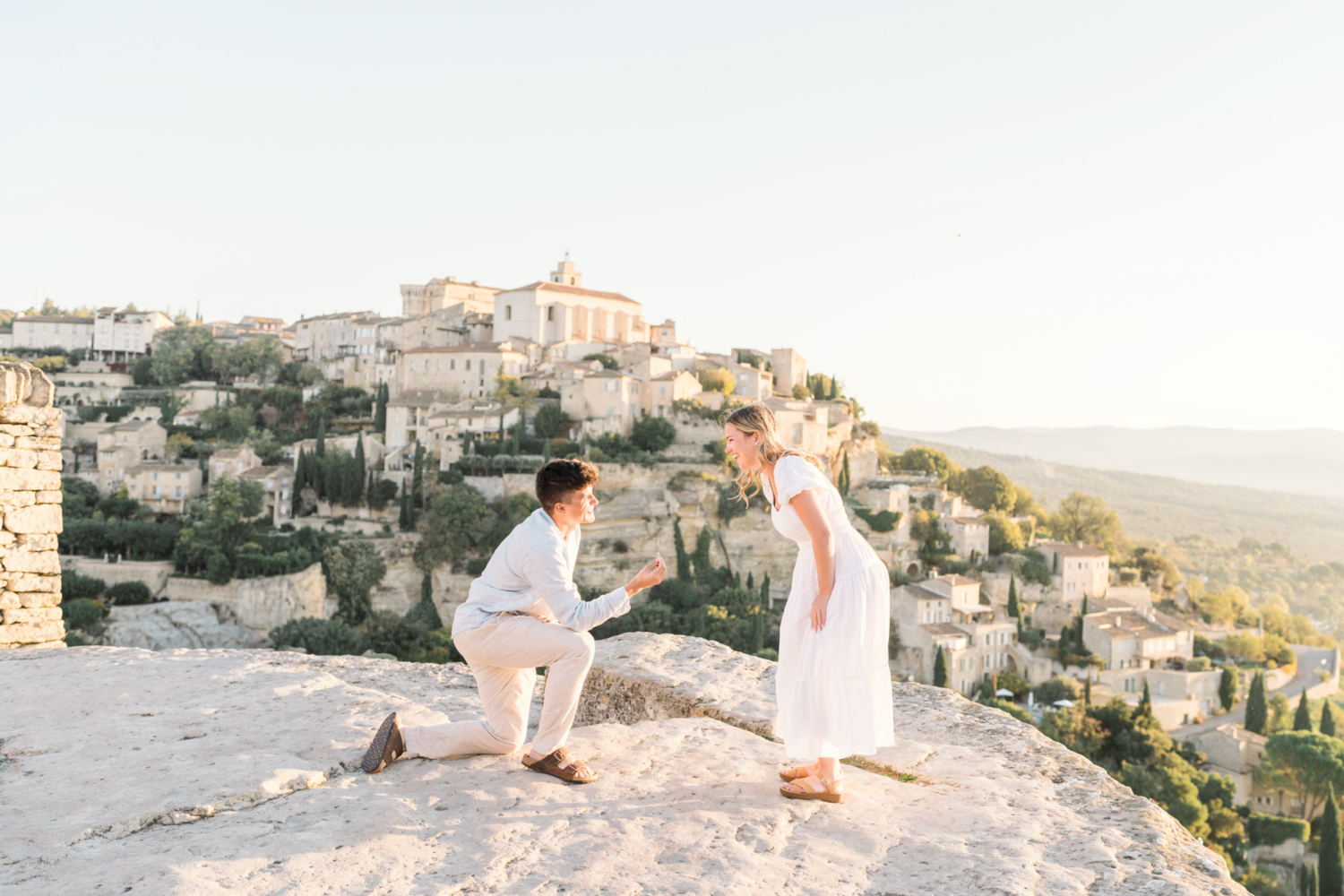 man proposes to woman with beautiful view in gordes provence france