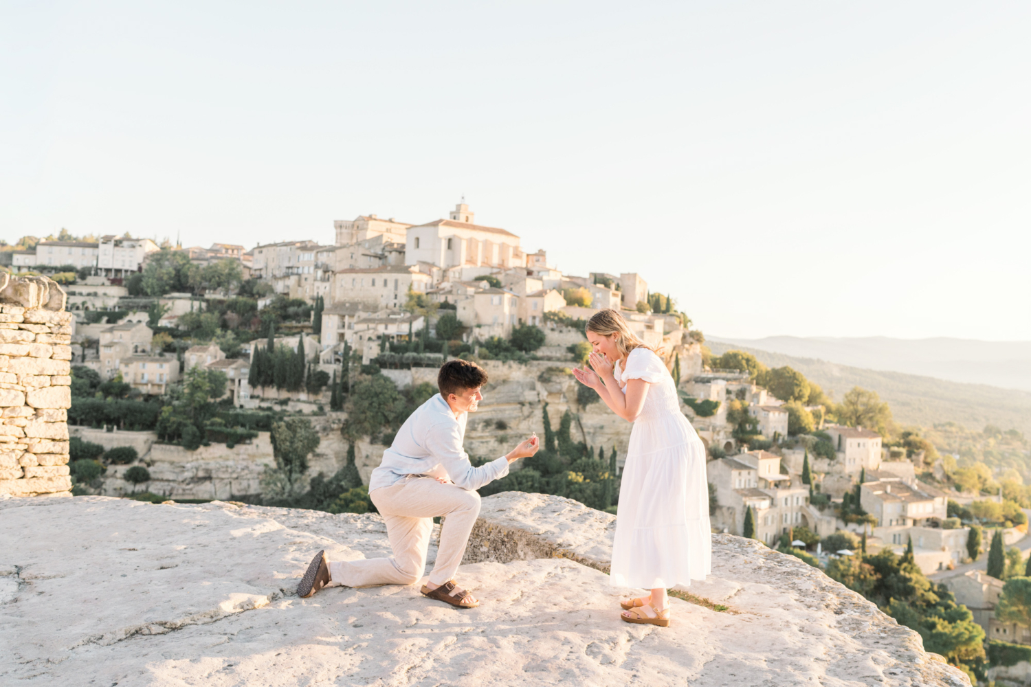 man gets one knee and proposes in gordes provence france