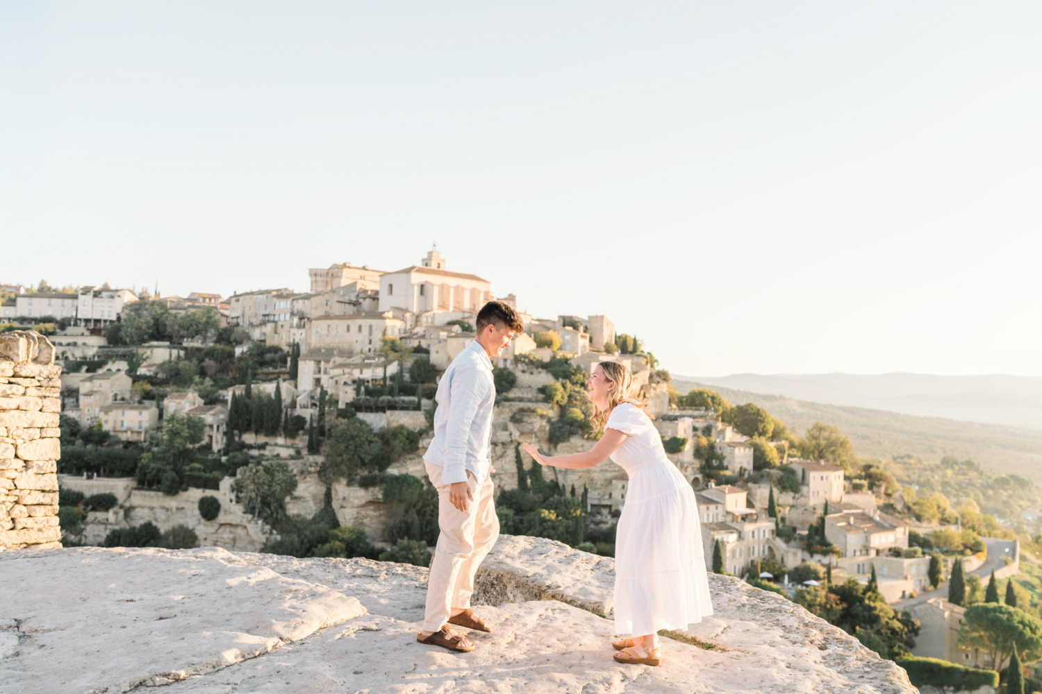 woman is excited after surprise proposal in gordes provence france