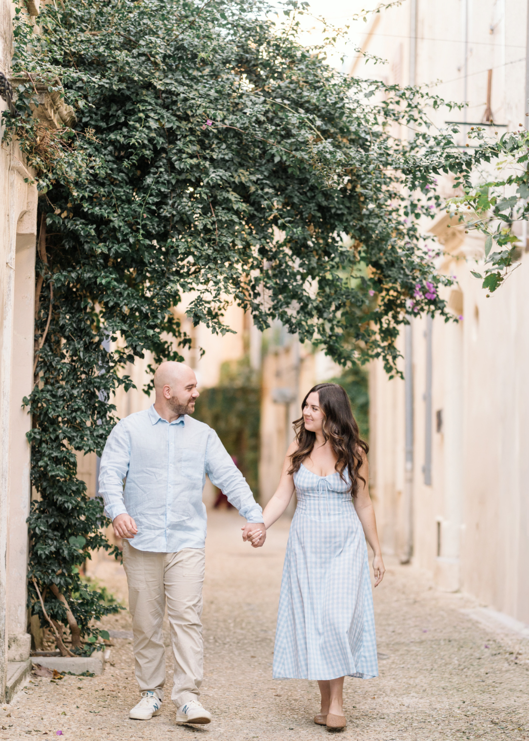 beautiful couple walk through the beautiful streets of arles france