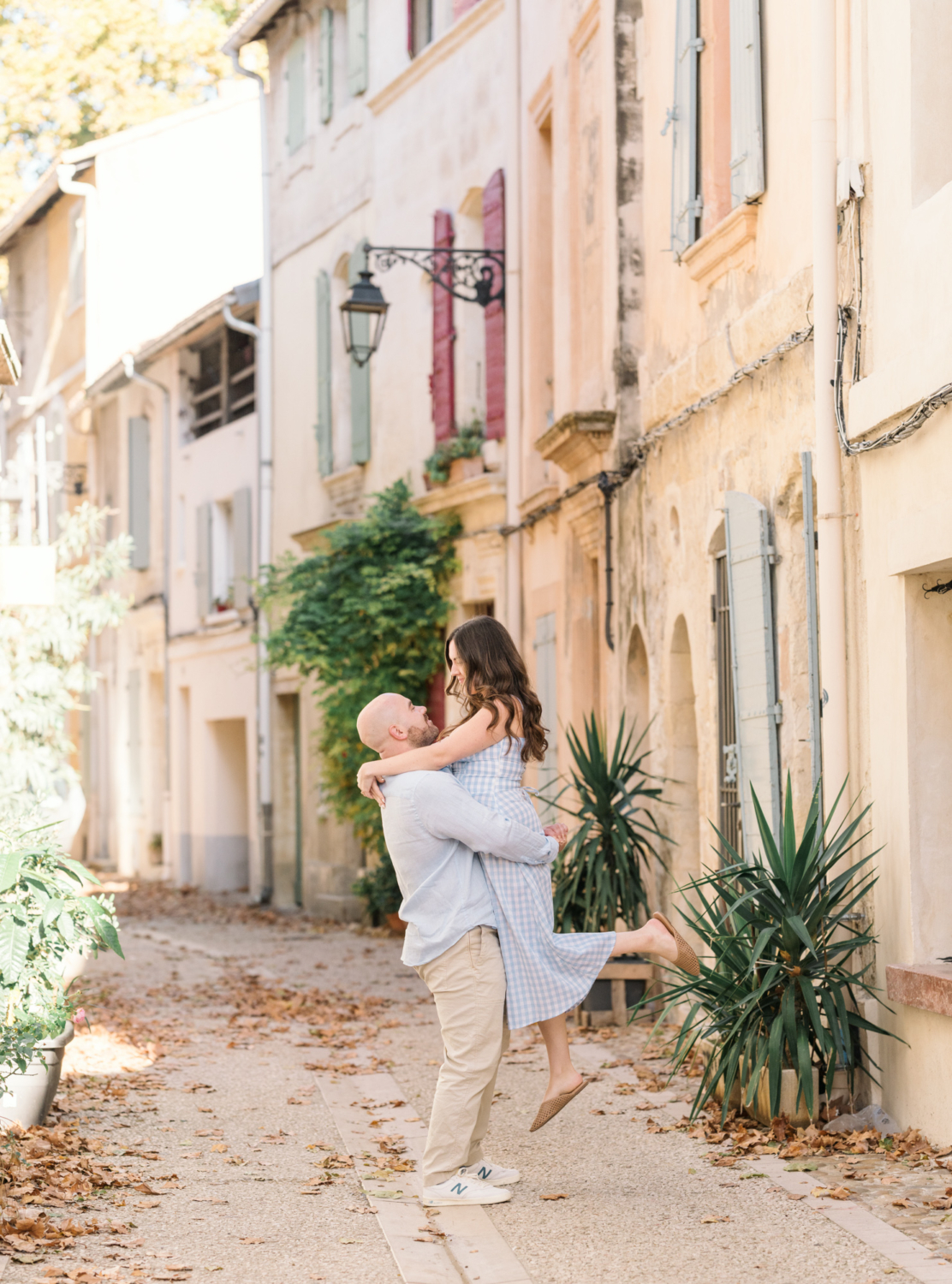 engaged couple in a lift in arles france