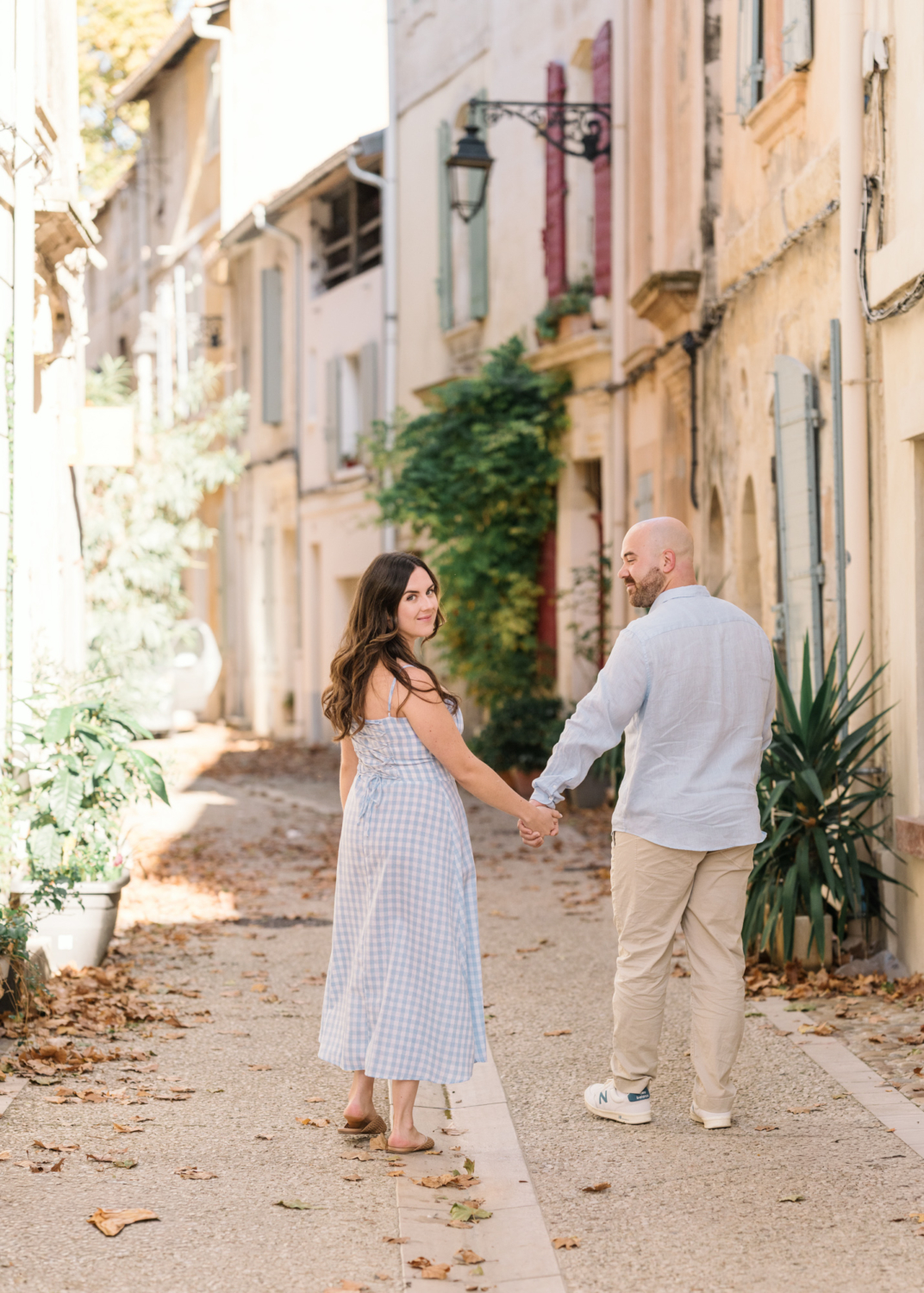 engaged couple hold hands in arles france