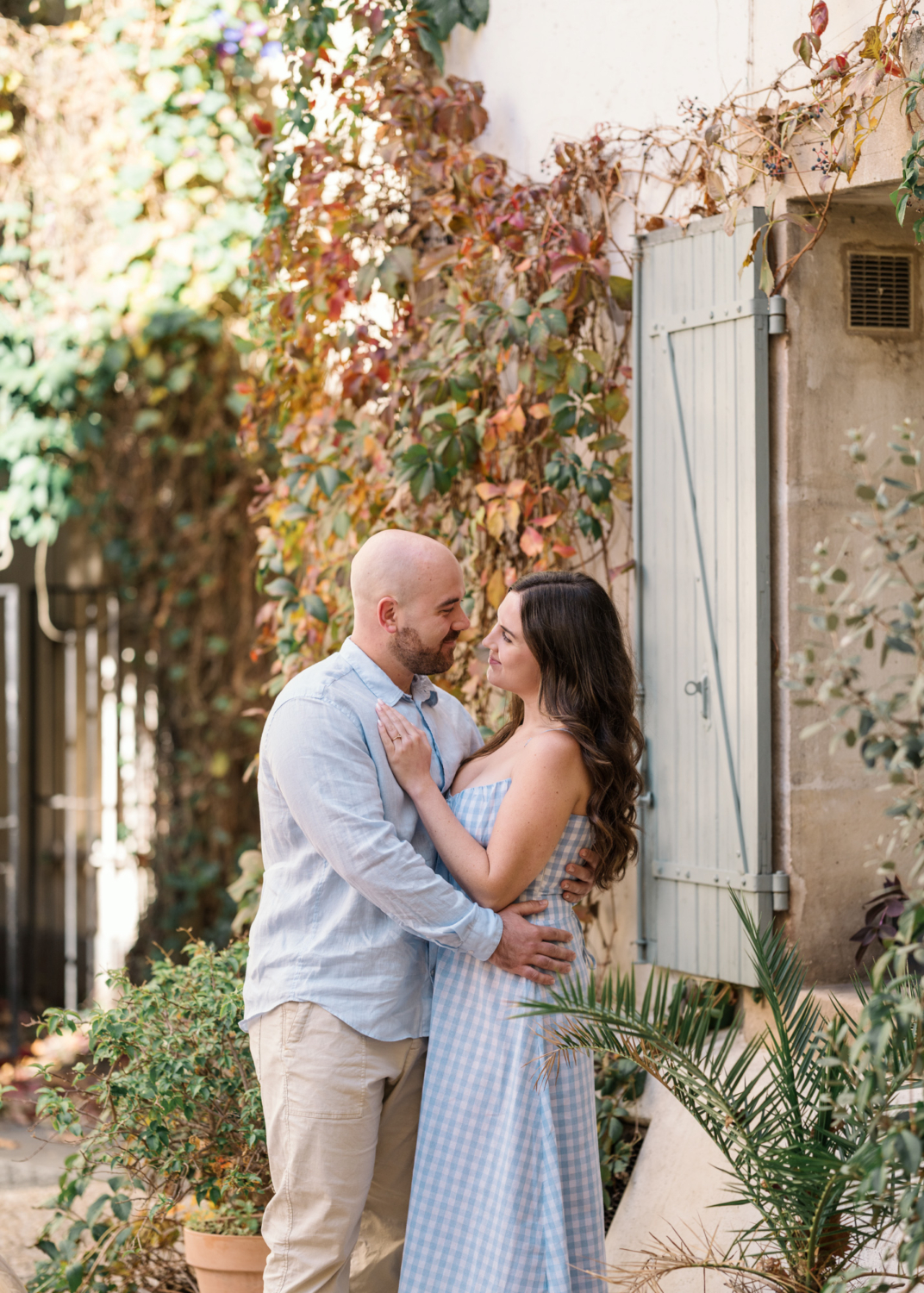 engaged couple pose on charming street in arles france