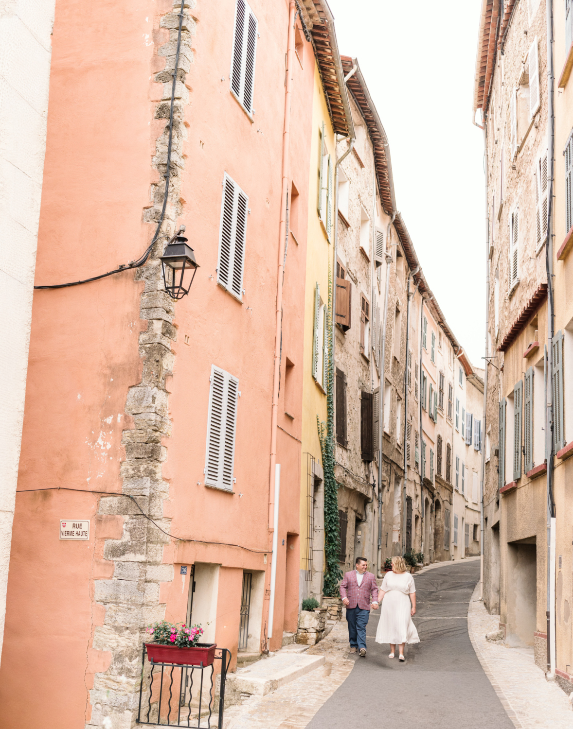 happy couple walk the streets of callas france