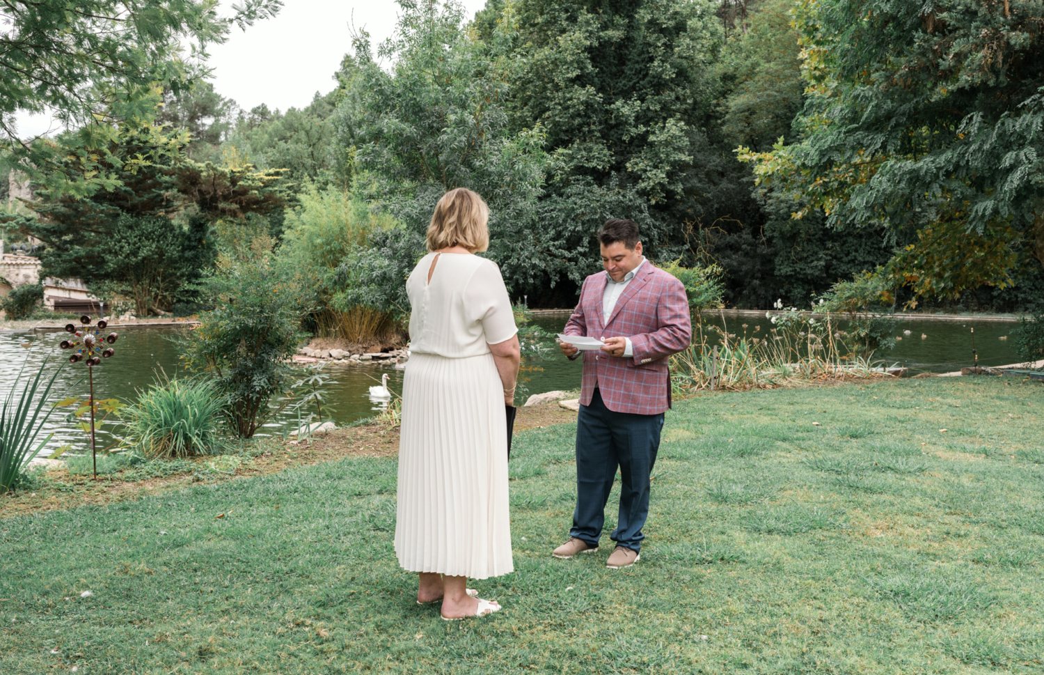 groom reads vows on his wedding day