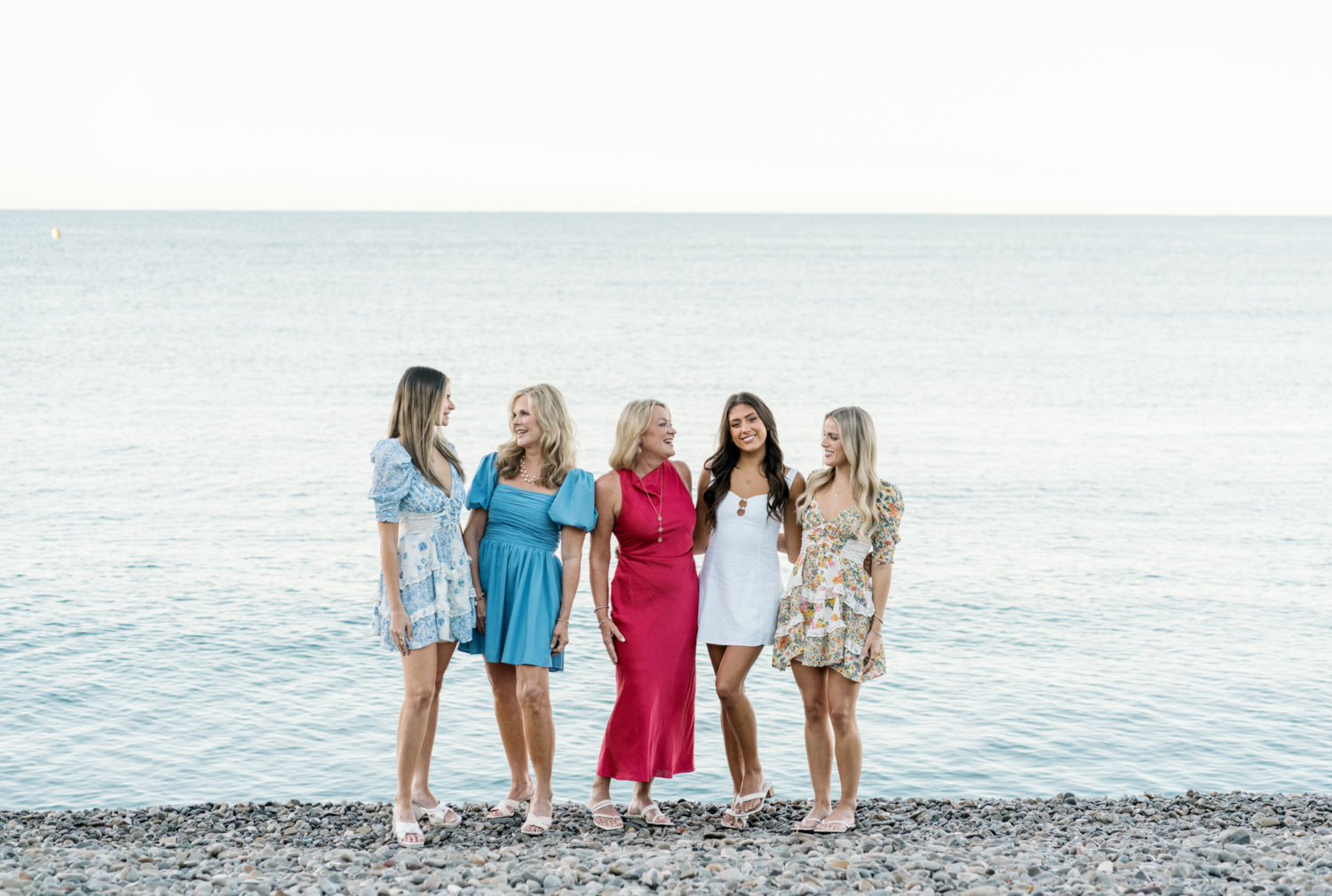 mothers and daughters laugh on the beach in nice france