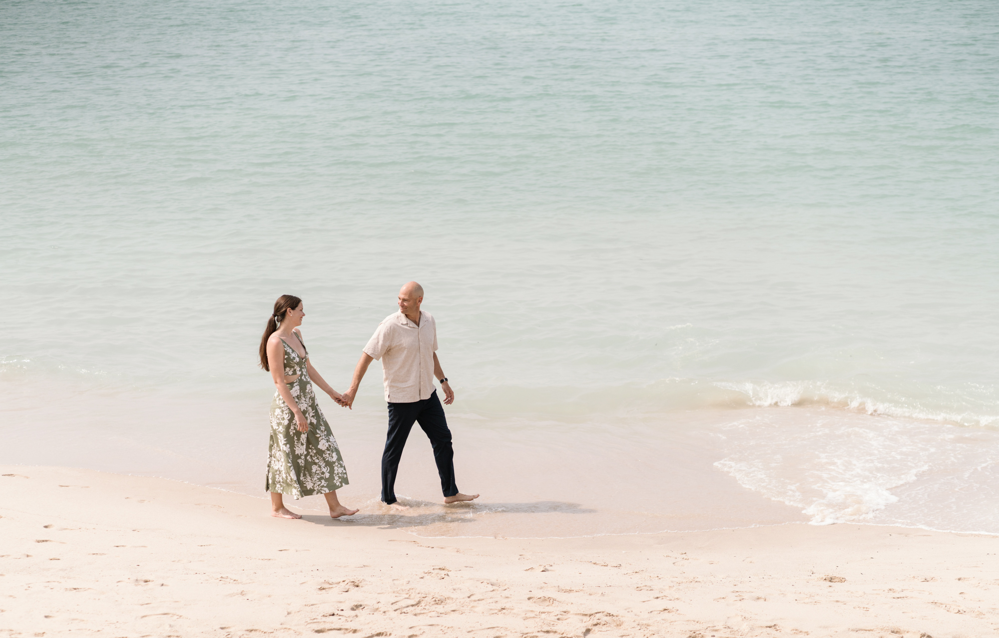 couples walks on beach in cannes