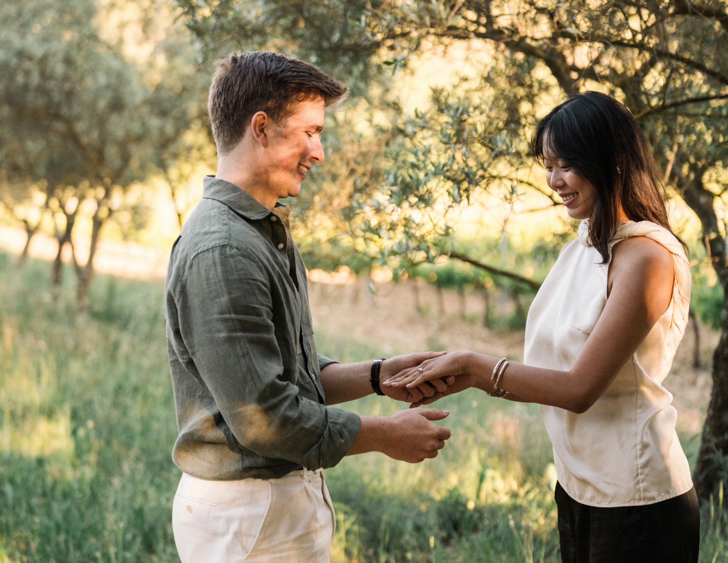 newly engaged couple admire diamond ring