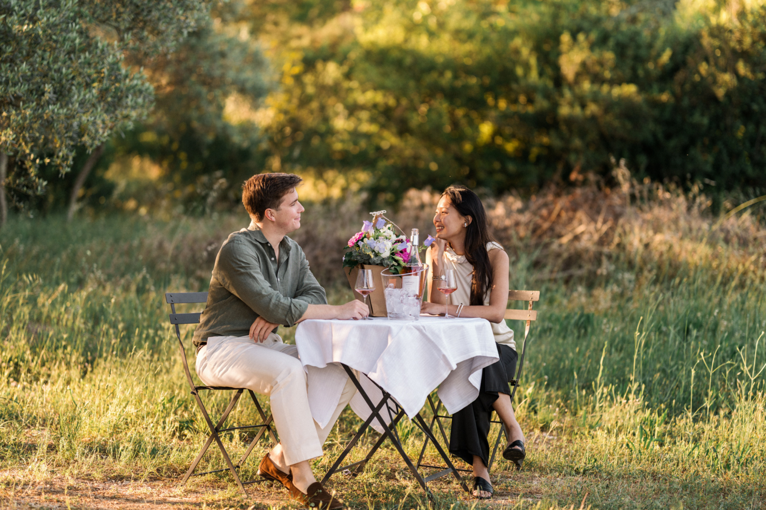 newly engaged couple enjoy wine at domaine de fontenille in provence