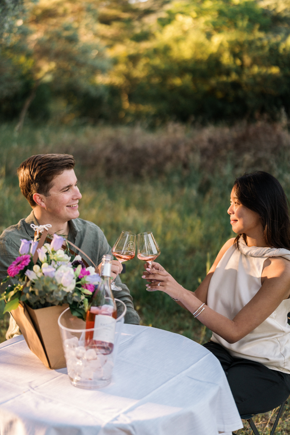 couple toast each other after their engagement in provence
