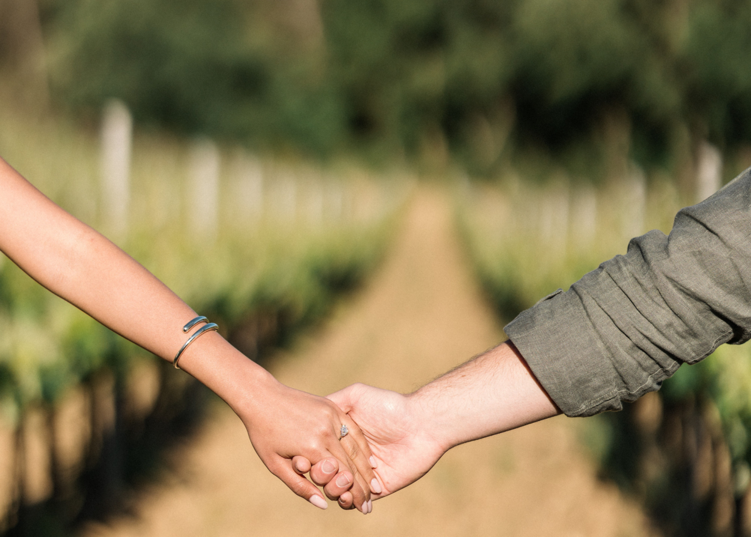 newly engaged couple show off diamond ring in provence