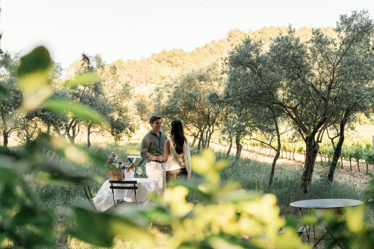man is about to ask woman to marry him in a vineyard in provence