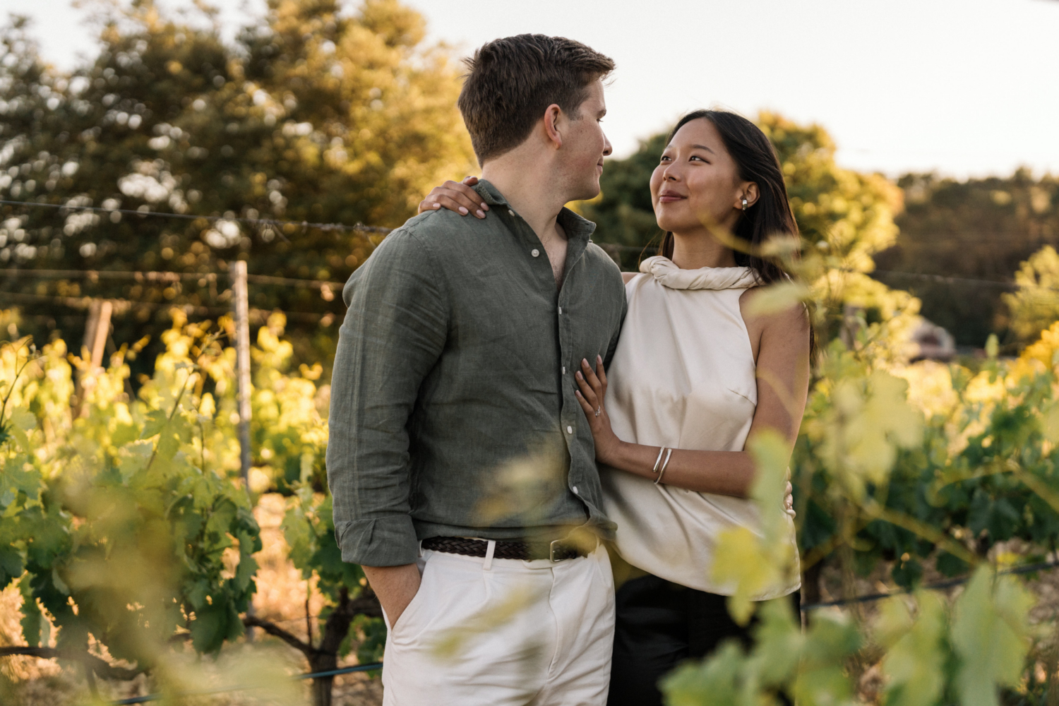 newly engaged couple embrace in a vineyard in provence france