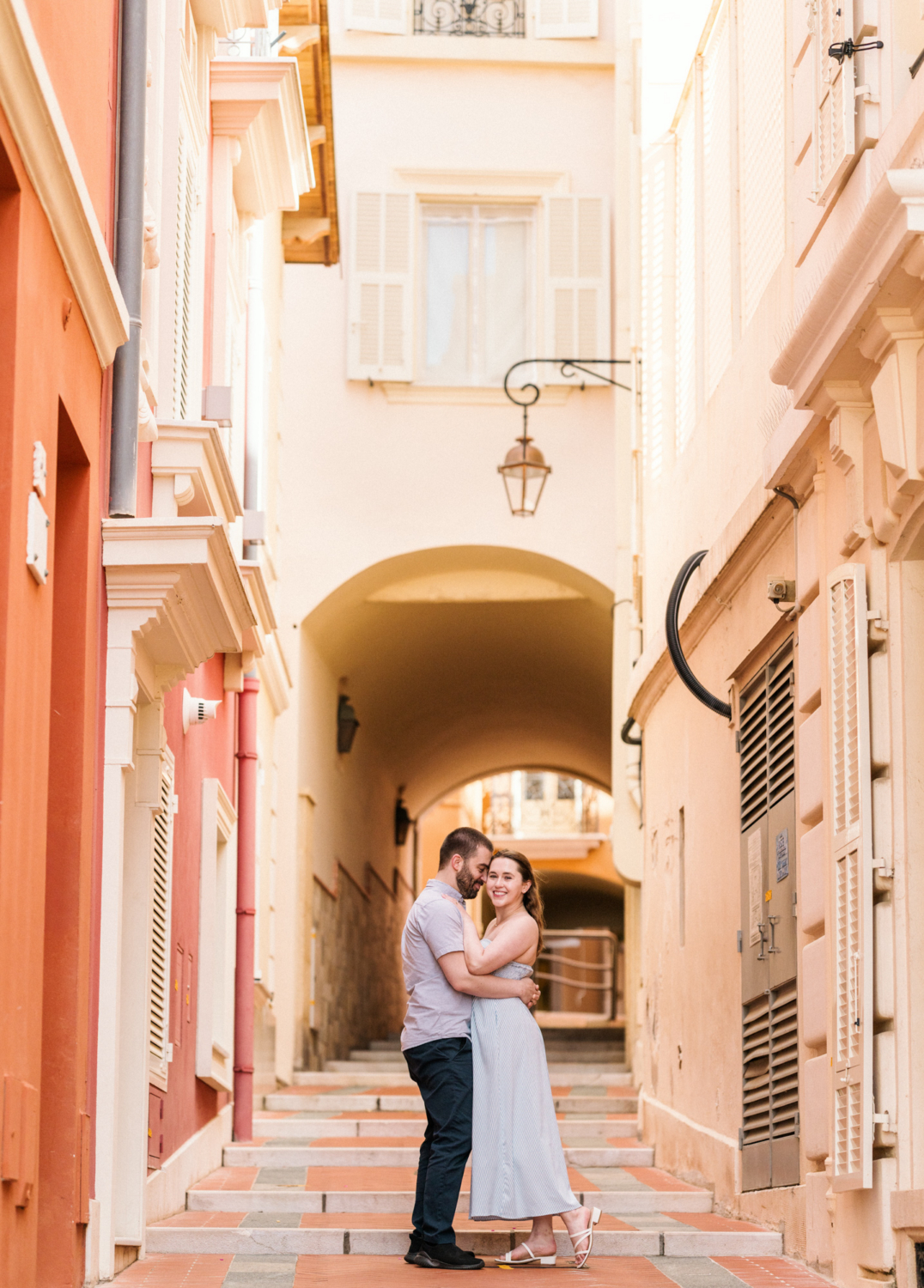 newlyweds embrace on ancient staircase in monaco