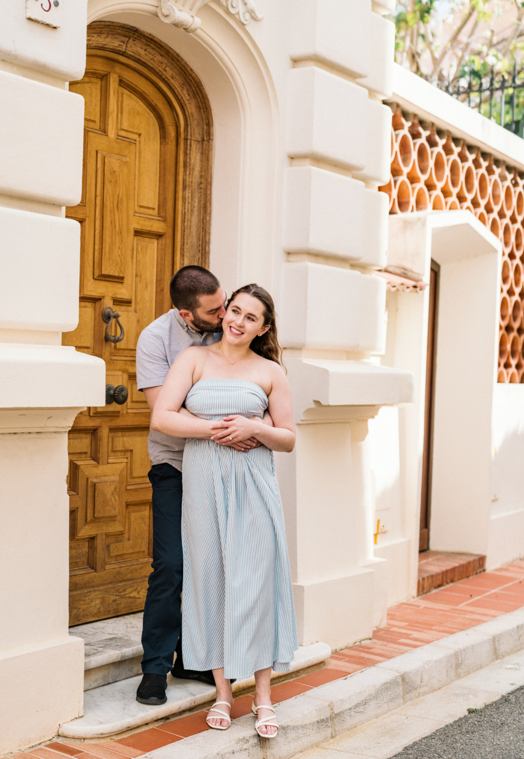 couple embrace in old town monaco