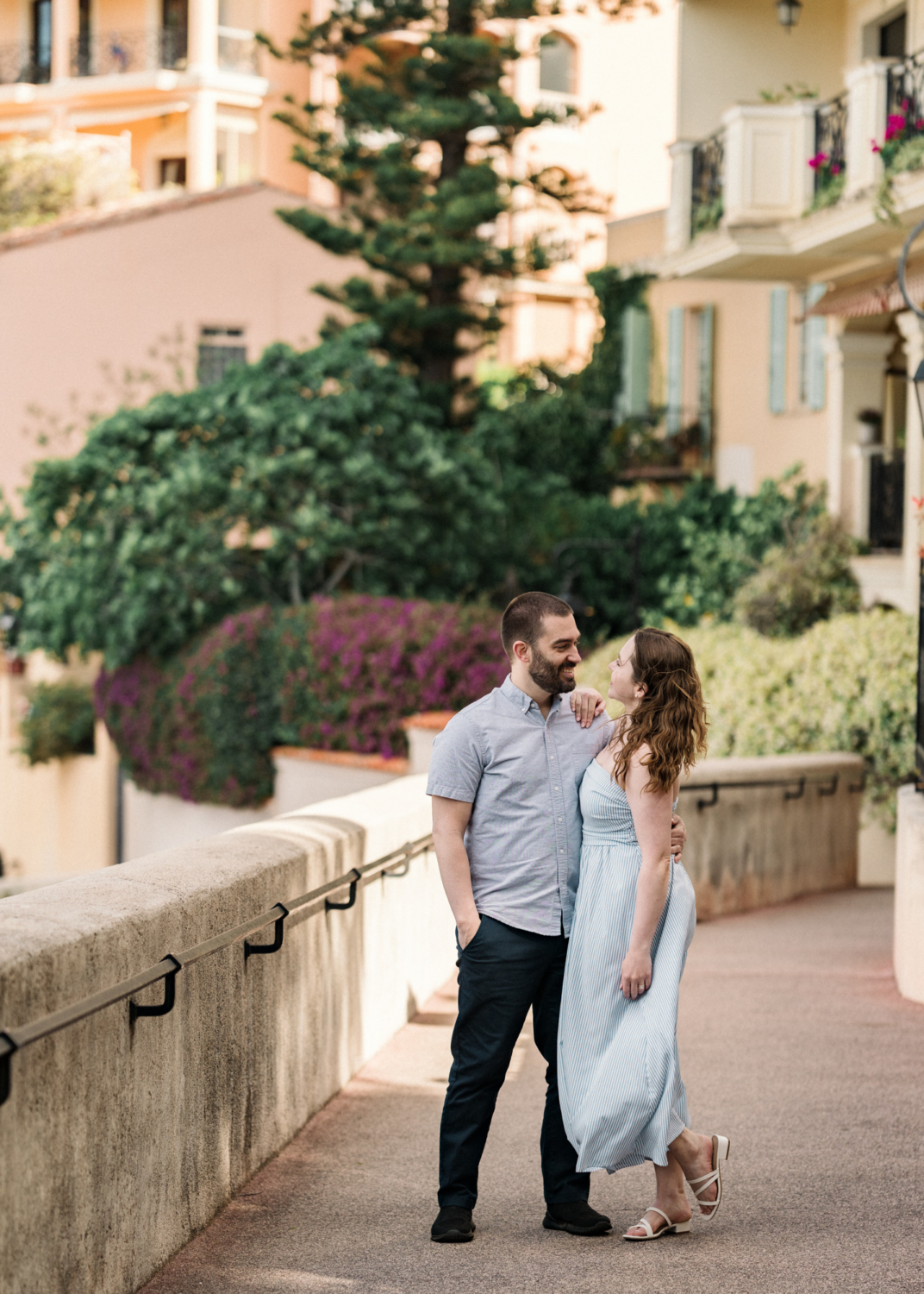 newlyweds pose on a walk in monaco