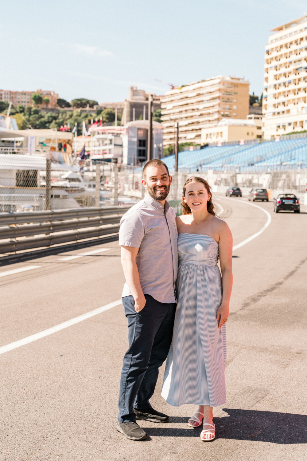 couple stands on the road in monaco ready for the f1 races