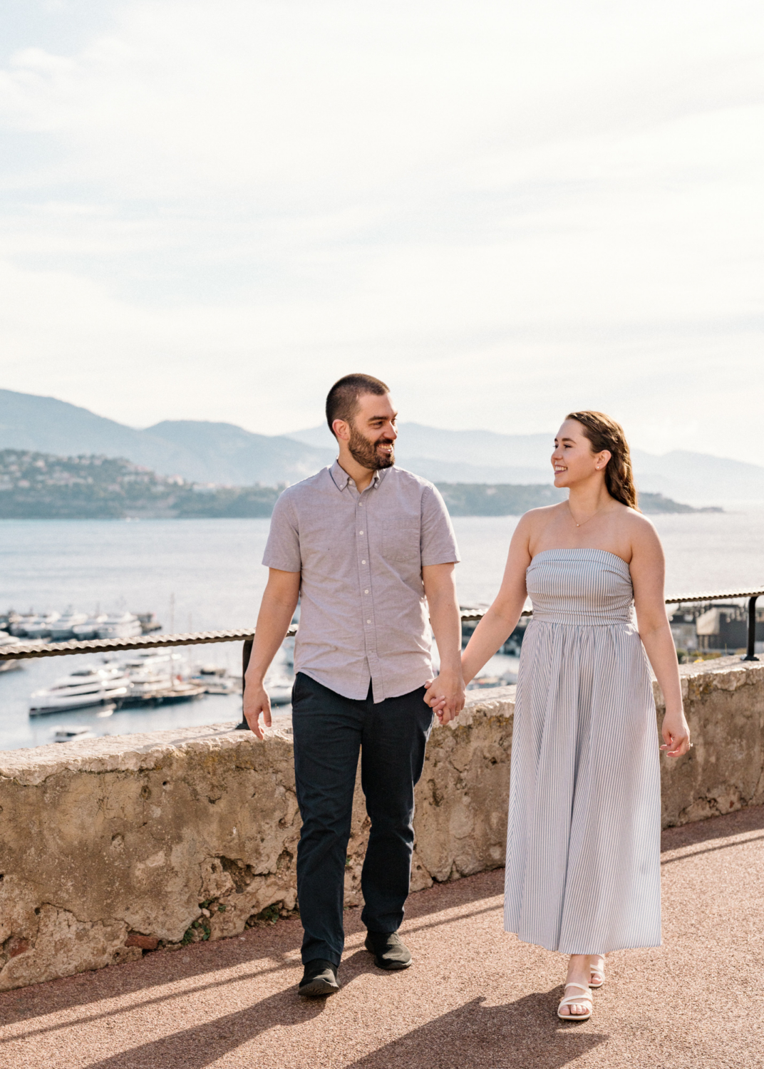 beautiful couple walk above monaco harbor