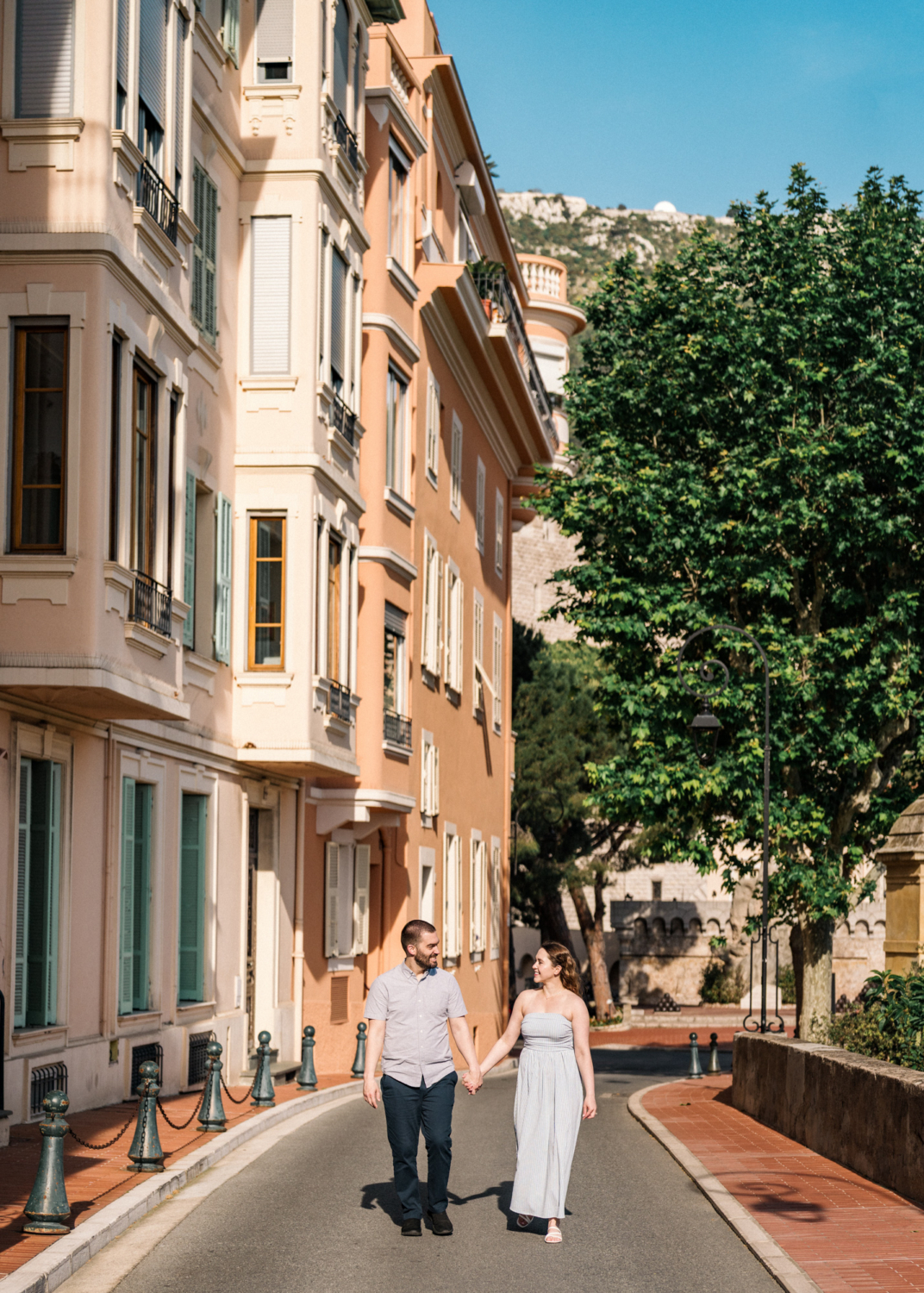 newlyweds walk through the streets of monaco
