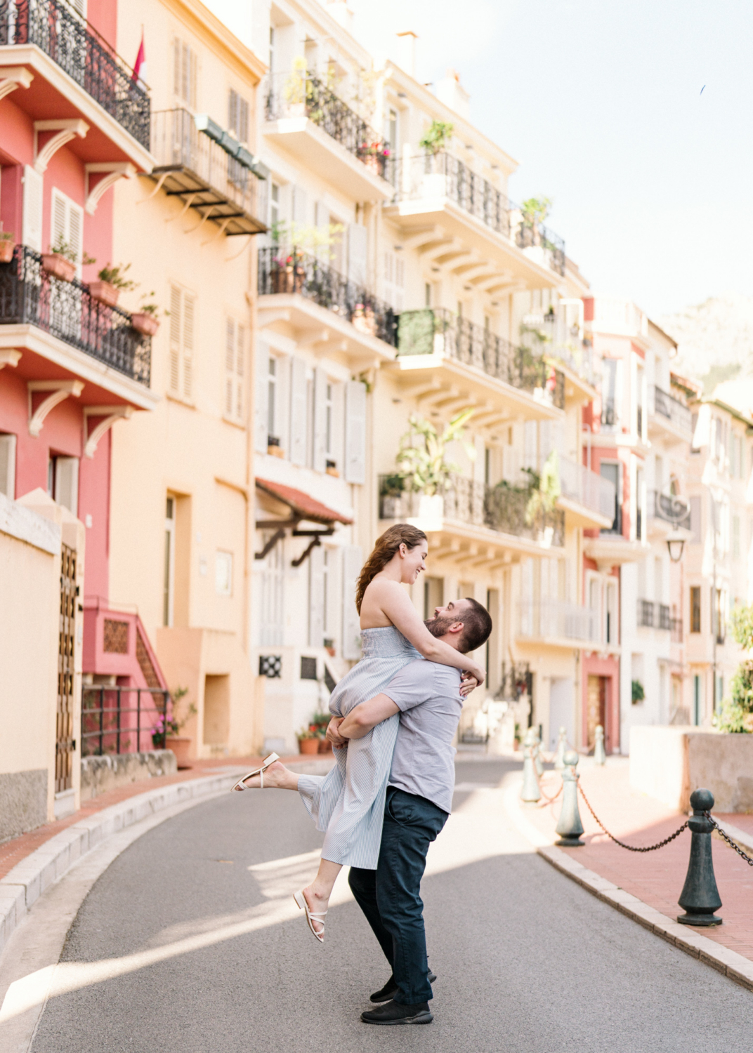 man twirls woman on the streets of monaco