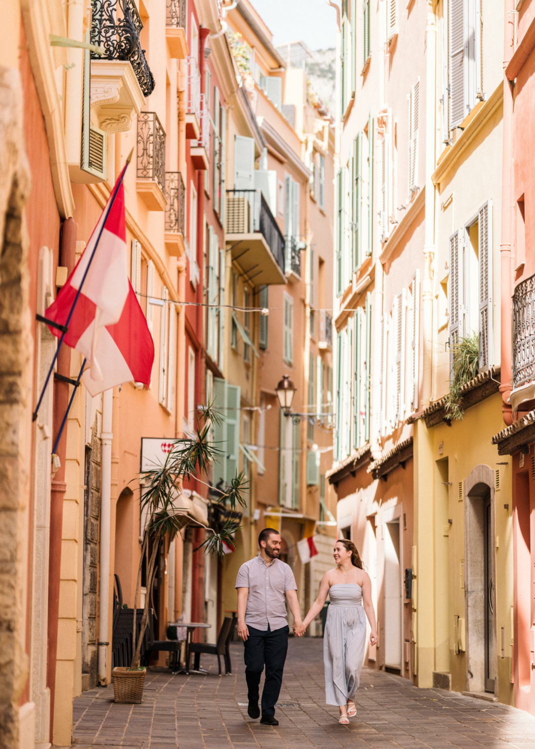 beautiful couple walk hand in hand in monaco