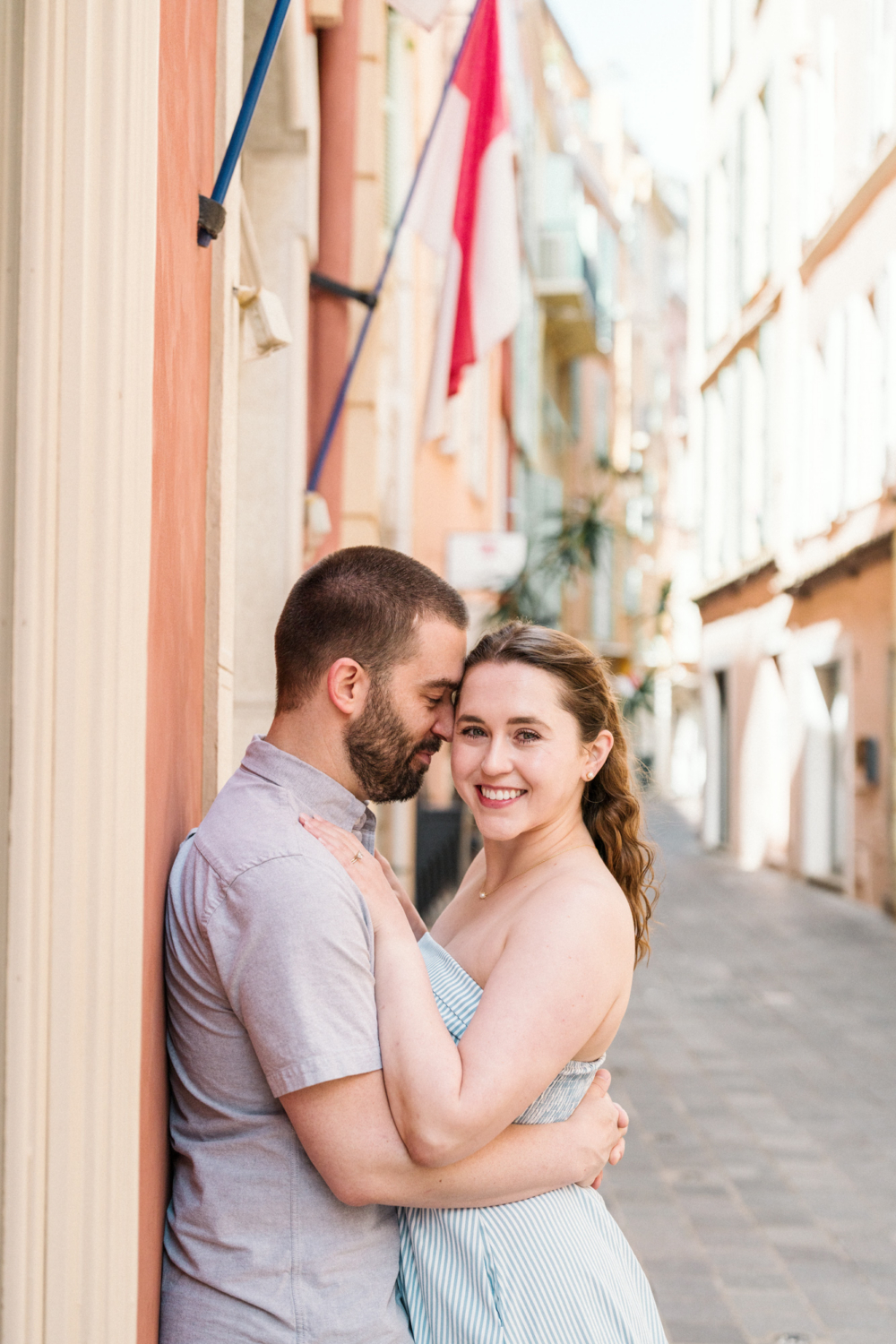 cute couple embrace on the streets of monaco