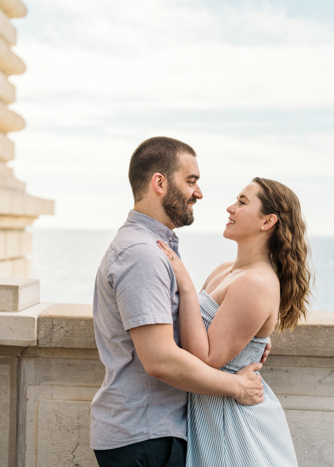 romantic couple pose with view of sea in monaco