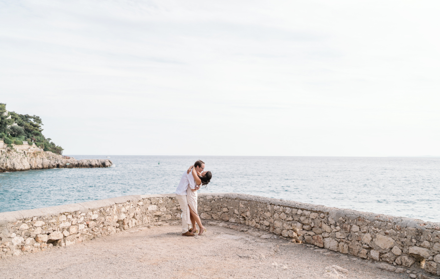 couple embrace after their engagement on coco beach nice