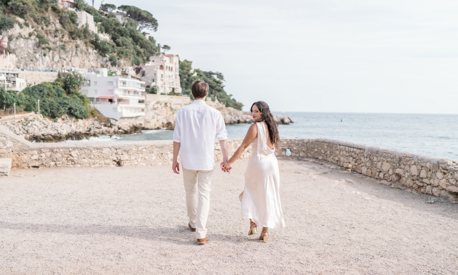 newly engaged couple walk at coco beach in nice france
