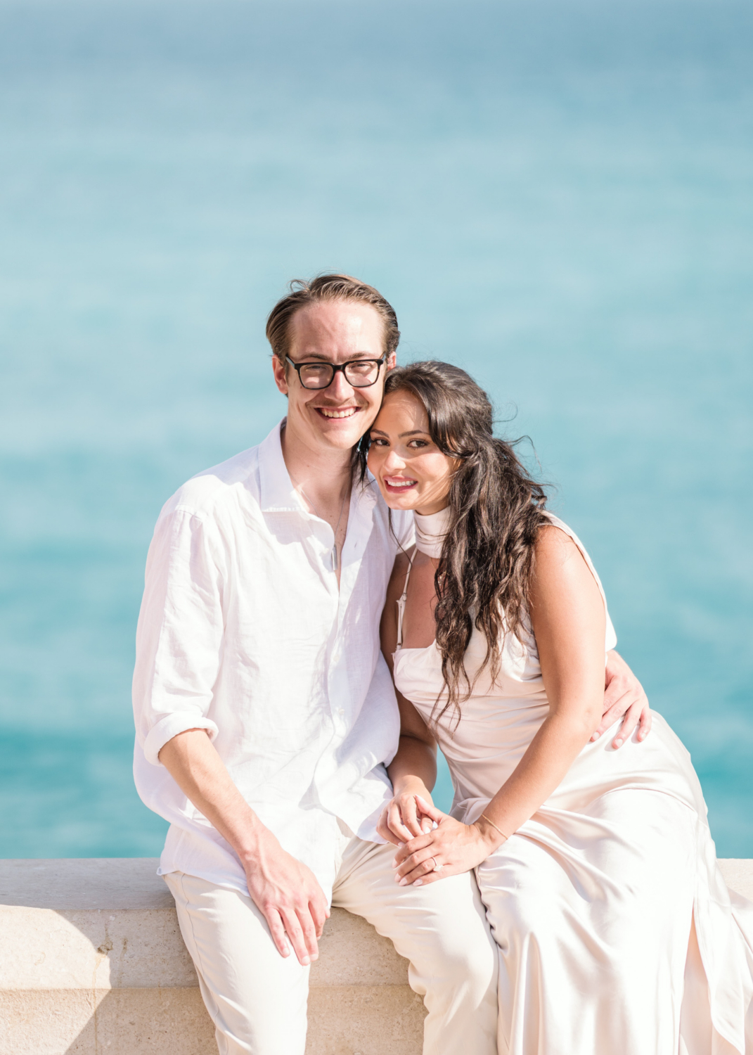 newly engaged couple posing with sea in background in nice france