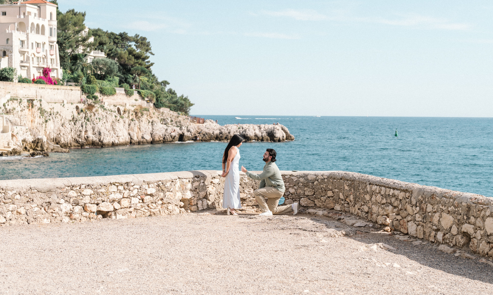 man proposes in nice, france with view of sea
