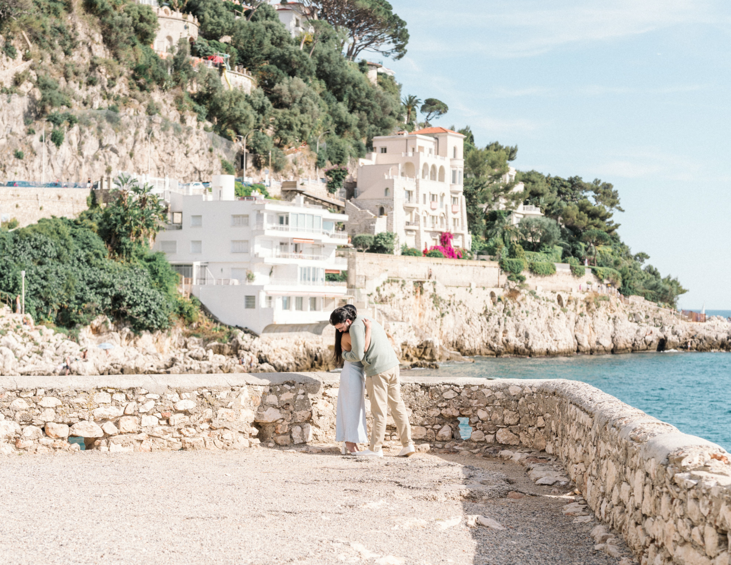 newly engaged couple hug after engagement in nice, france