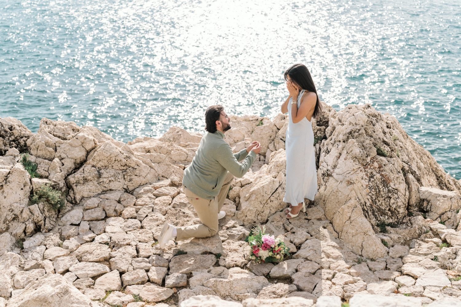 woman is shocked as man proposes in nice, france