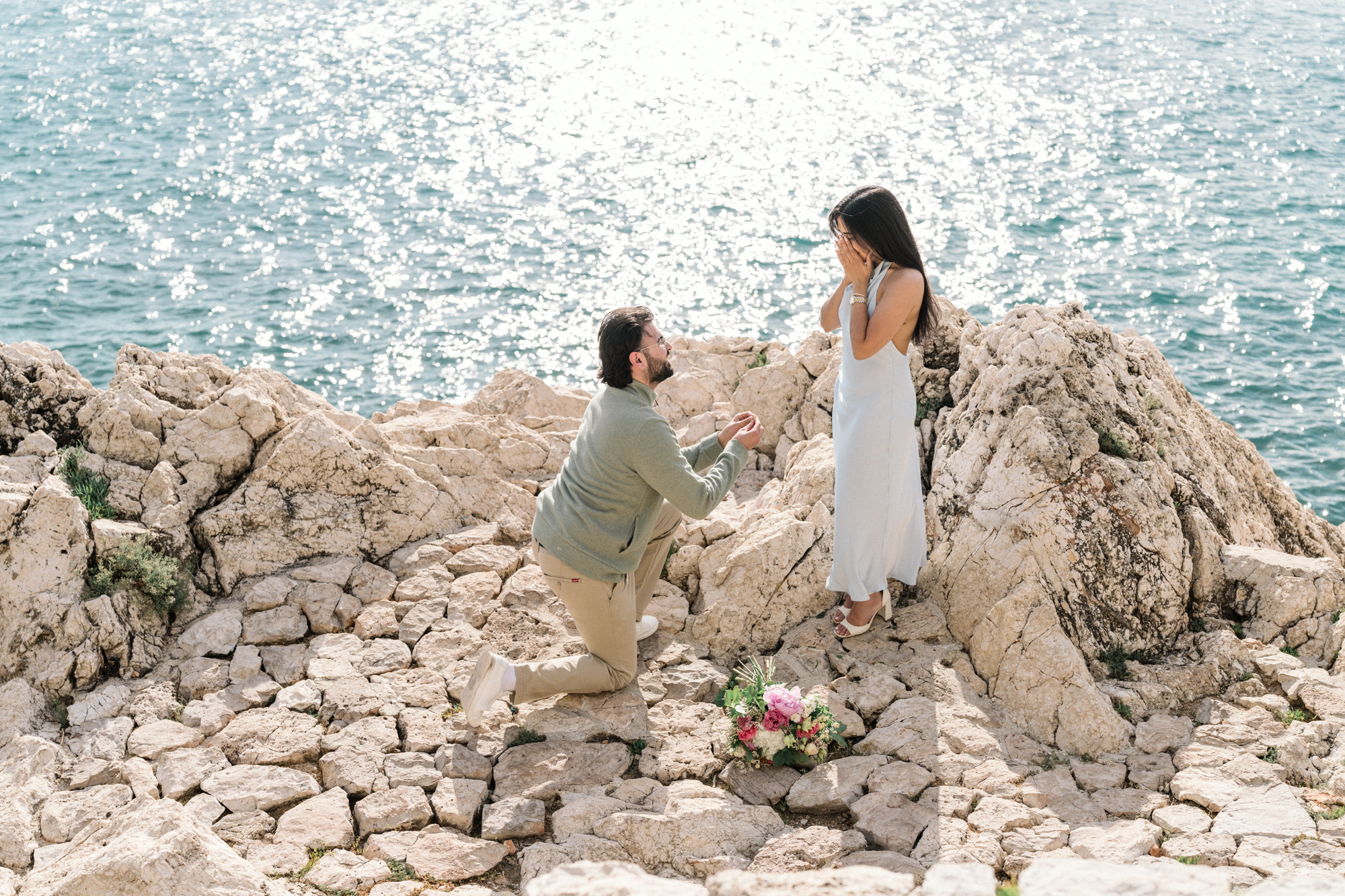 woman is shocked as man proposes in nice, france