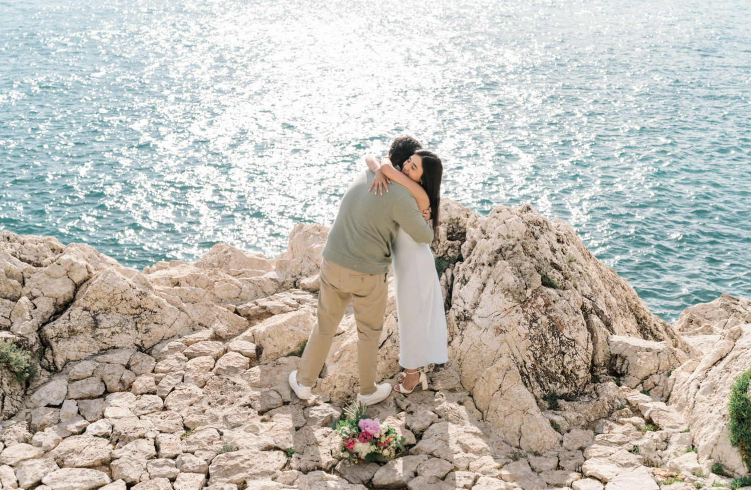 couple hug after their engagement in nice, france