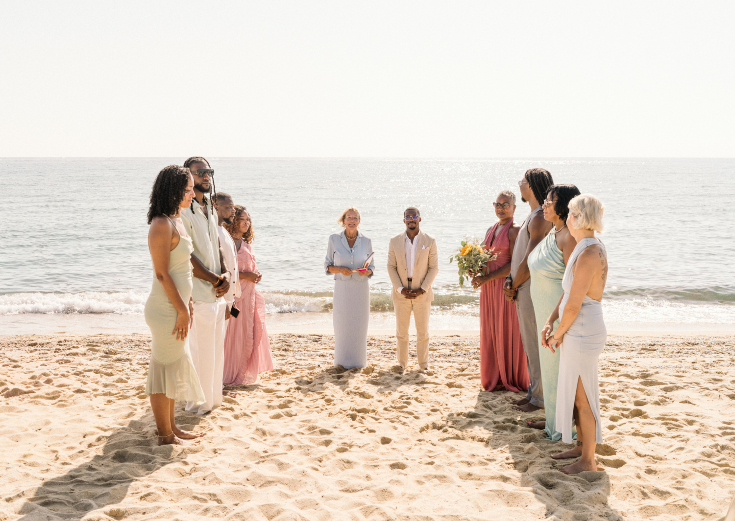group waits for bride on beach wedding in saint tropez
