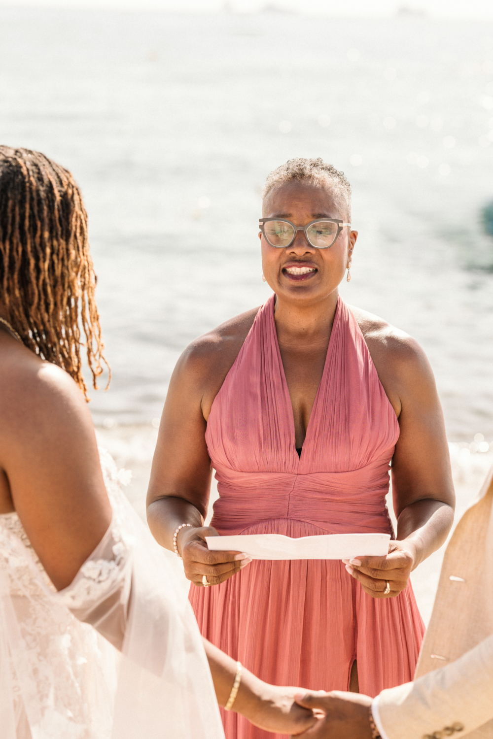mother of bride reads during ceremony in saint tropez