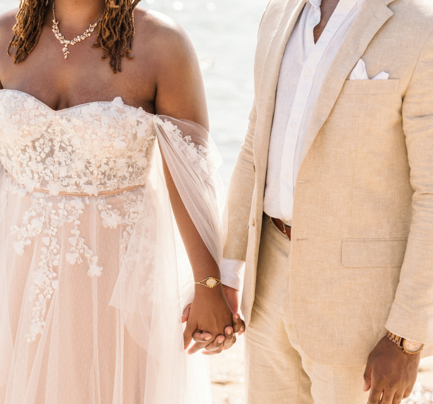 bride and groom hold hands on the beach in saint tropez