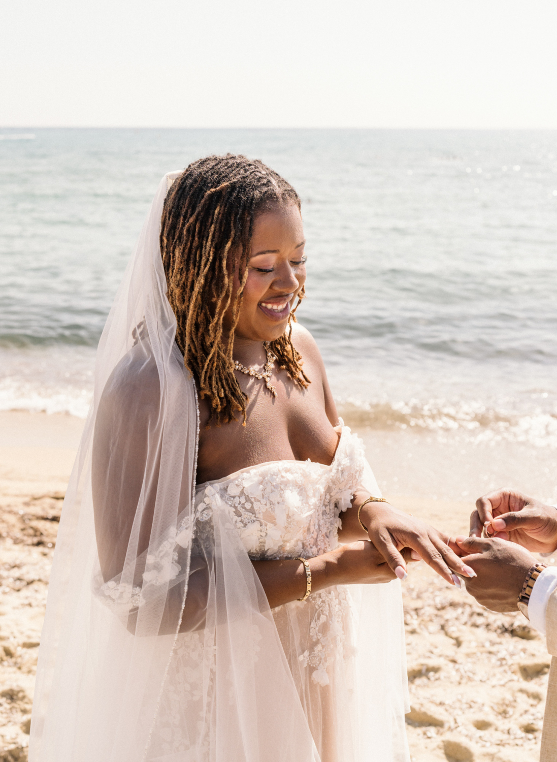 bride receives ring from groom in saint tropez