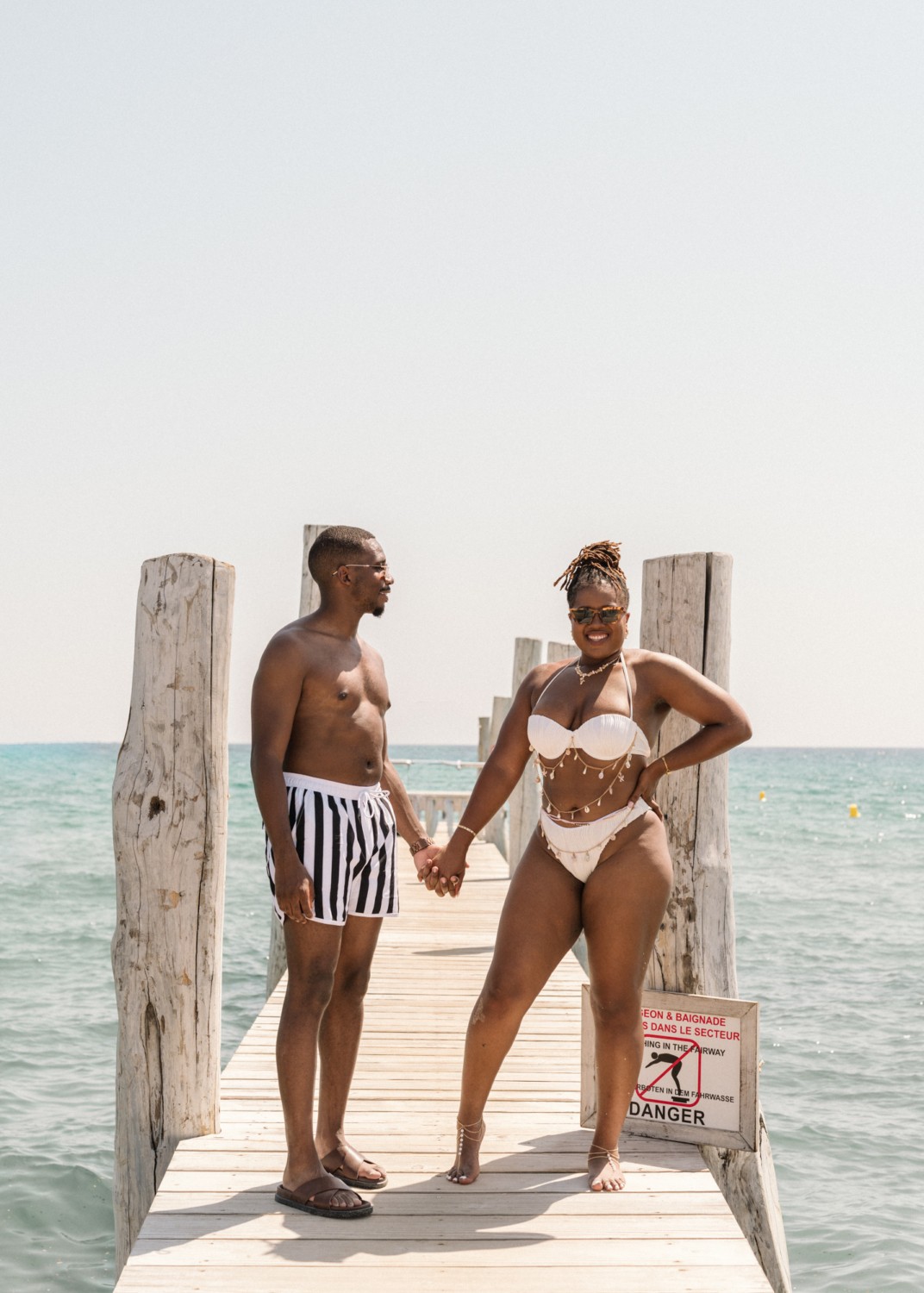 newlyweds pose on dock in saint tropez