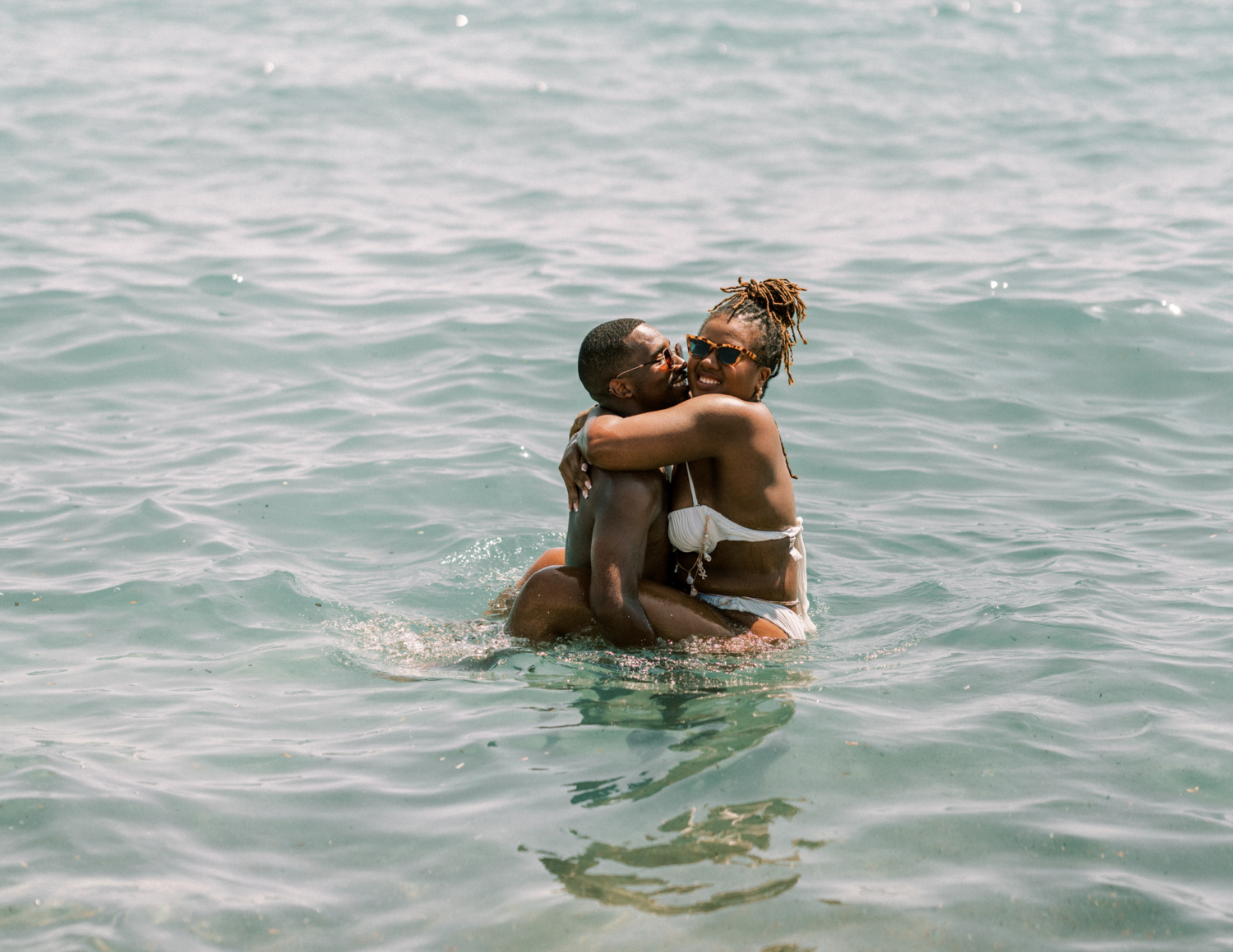 bride and groom celebrate by swimming in saint tropez
