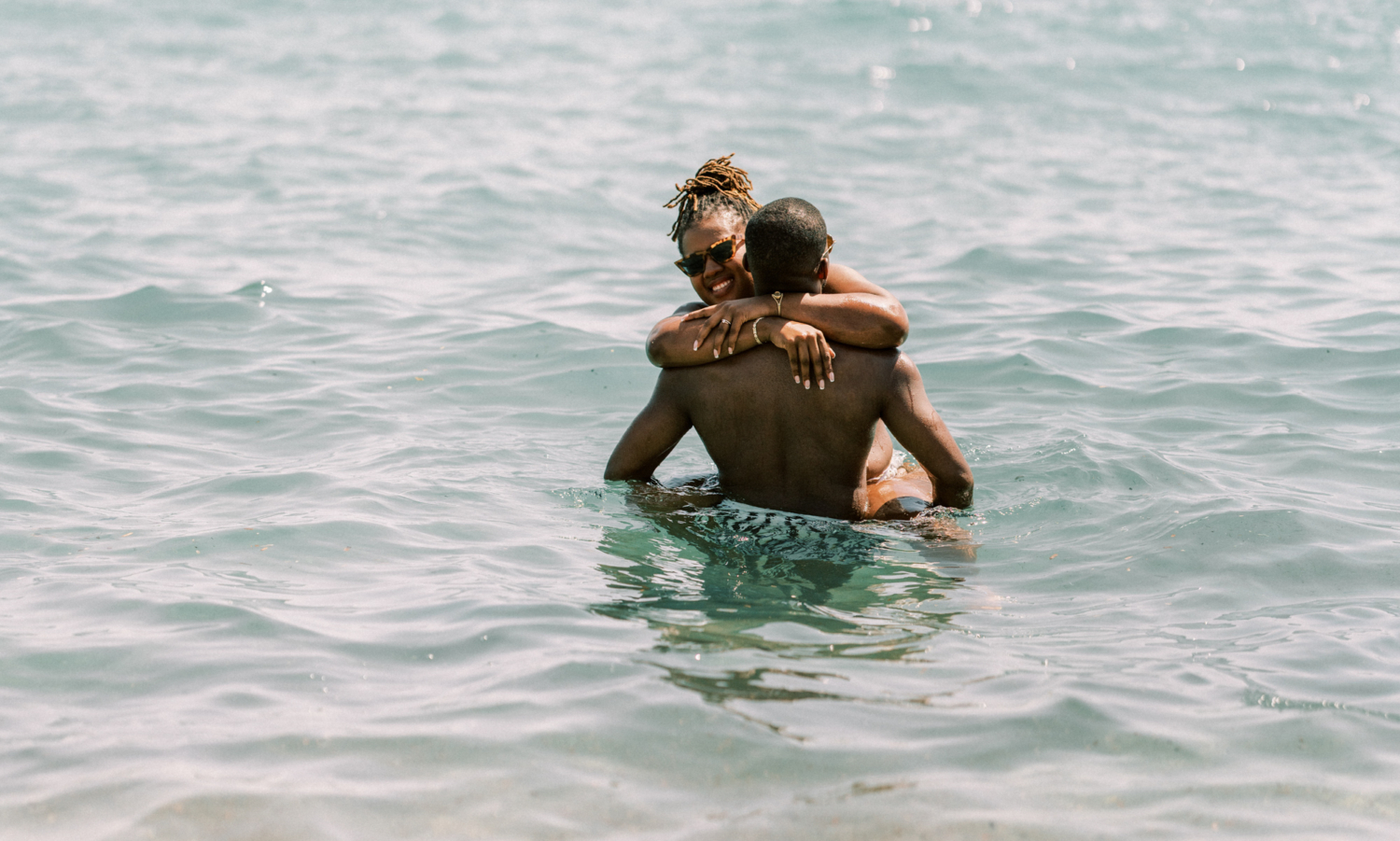bride and groom frolic in the water after wedding in saint tropez france